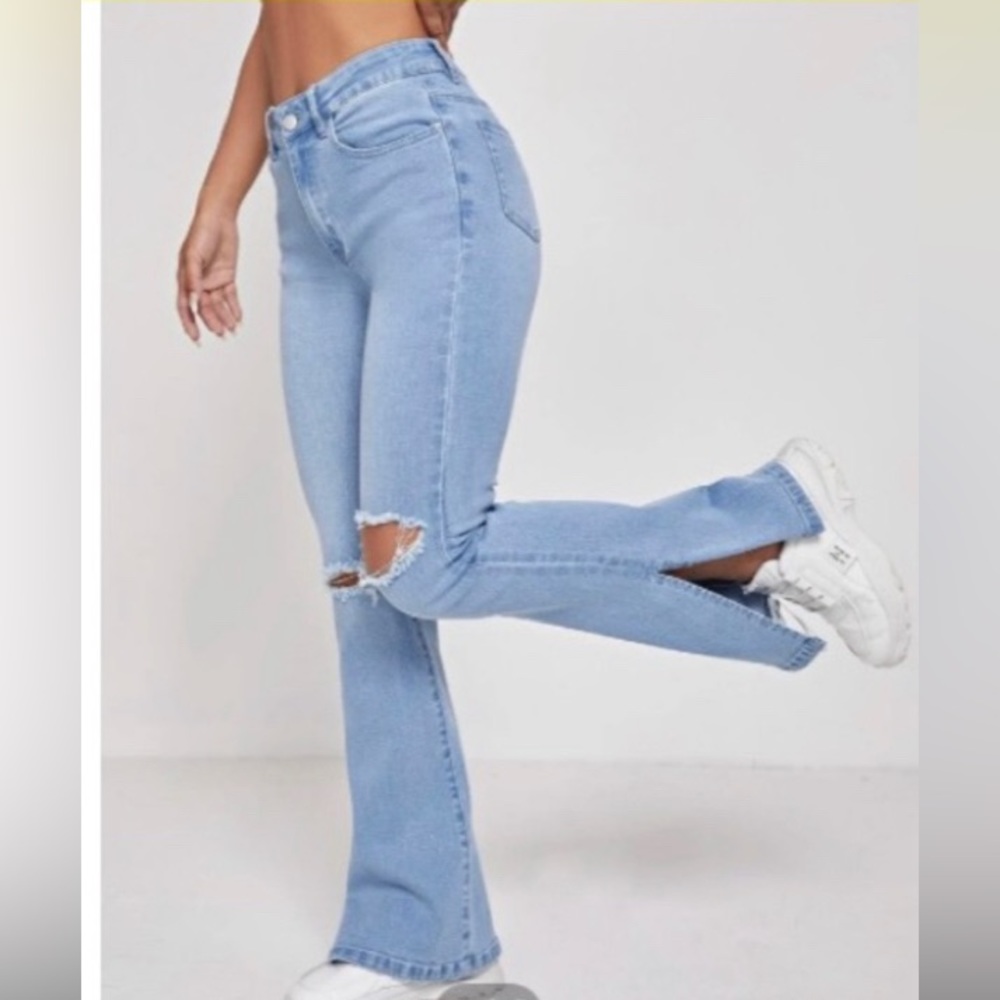 Light wash distressed flare jeans